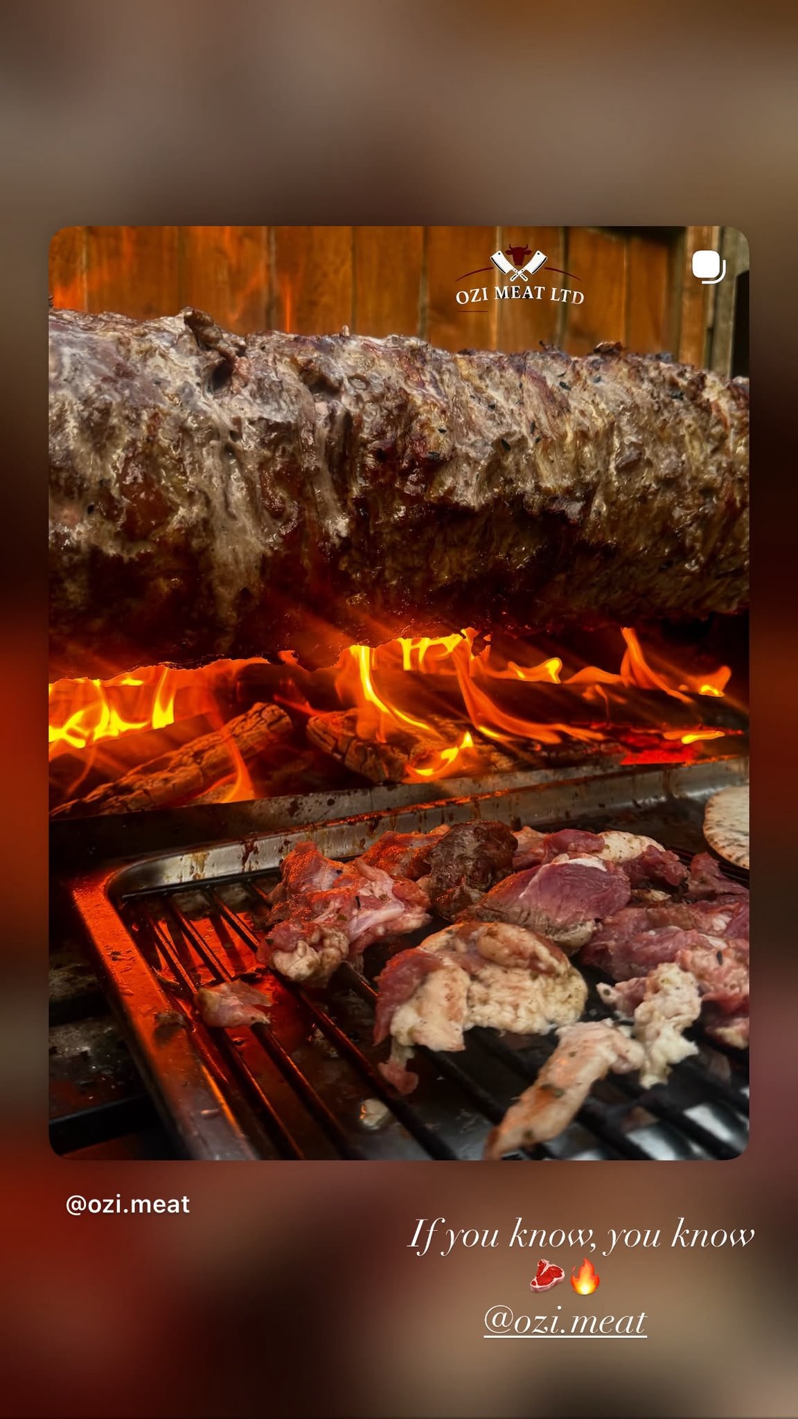 Lamb turning over an open wood fire