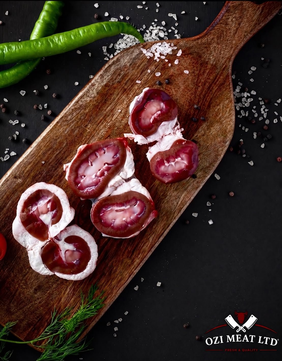Trimmed kidneys on a wooden board